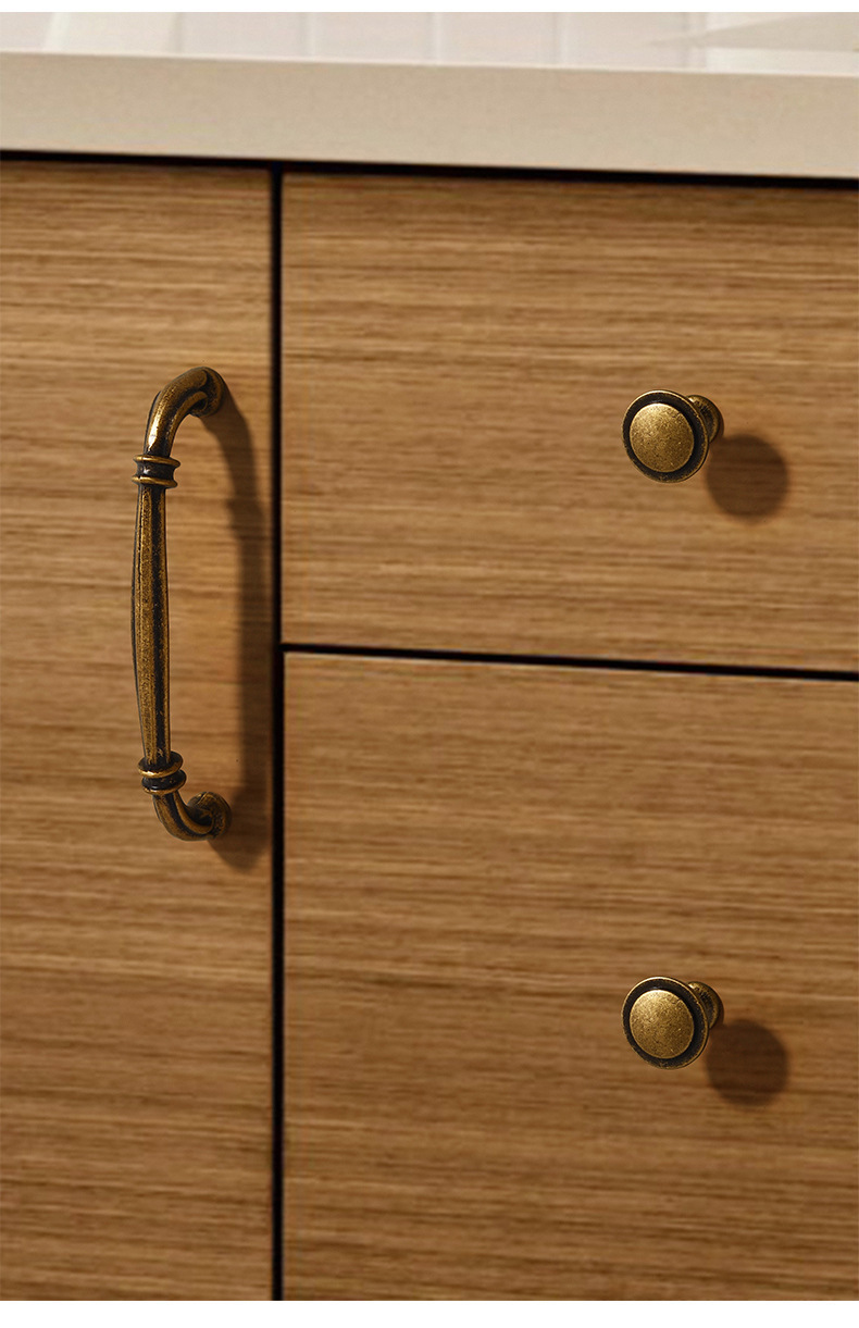 1997 cabinet handle and round knob in antique brass